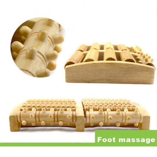 Wooden foot massage tool with detailed design on a white background